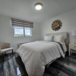 Bedroom #2 Queen Bed Top Luxury Mattress and Linens, sitting area and drawer with lamp. Spectacular views to El Yunque Mountains.